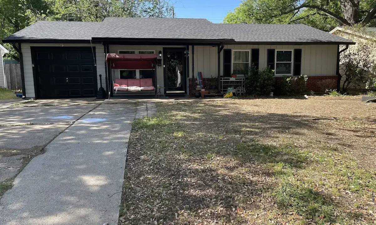 Metal Roof Installation crew at work on a residential roof in Channelview